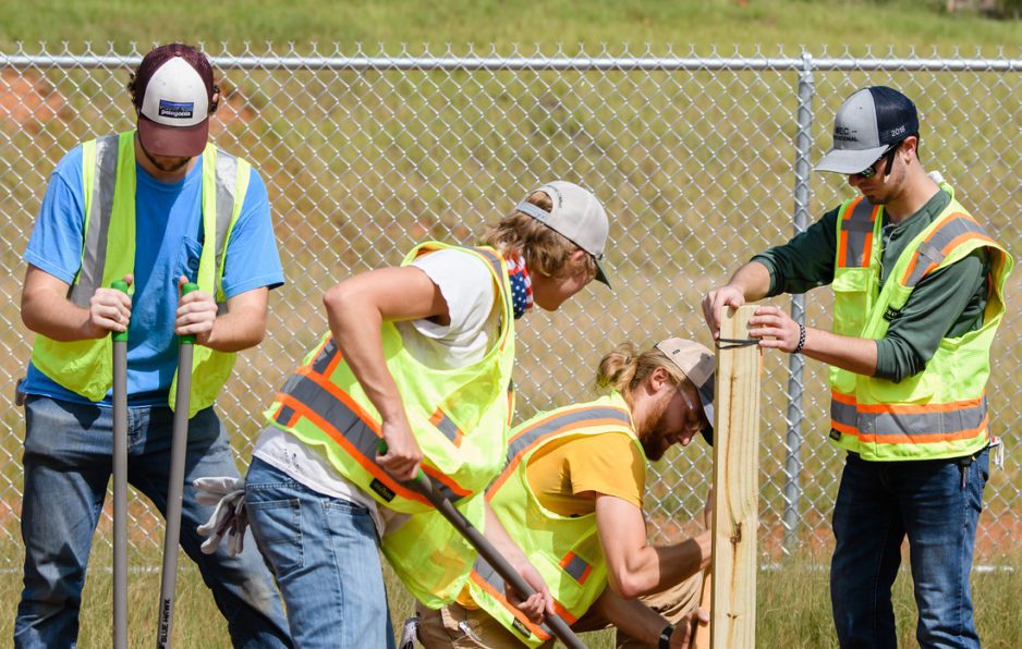 Industrial crew working together in summer heat