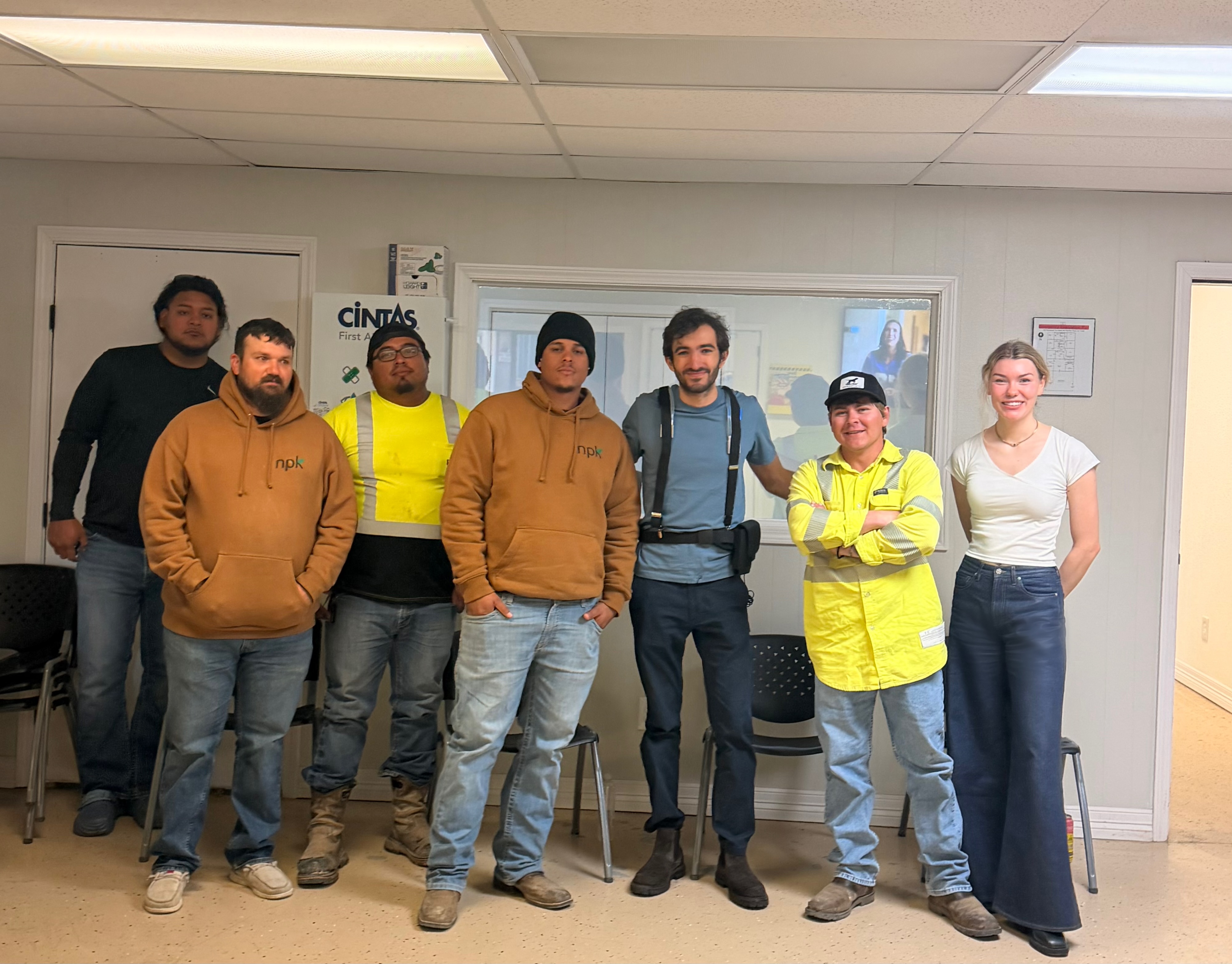 Clema founders with an industrial crew at a customer site visit