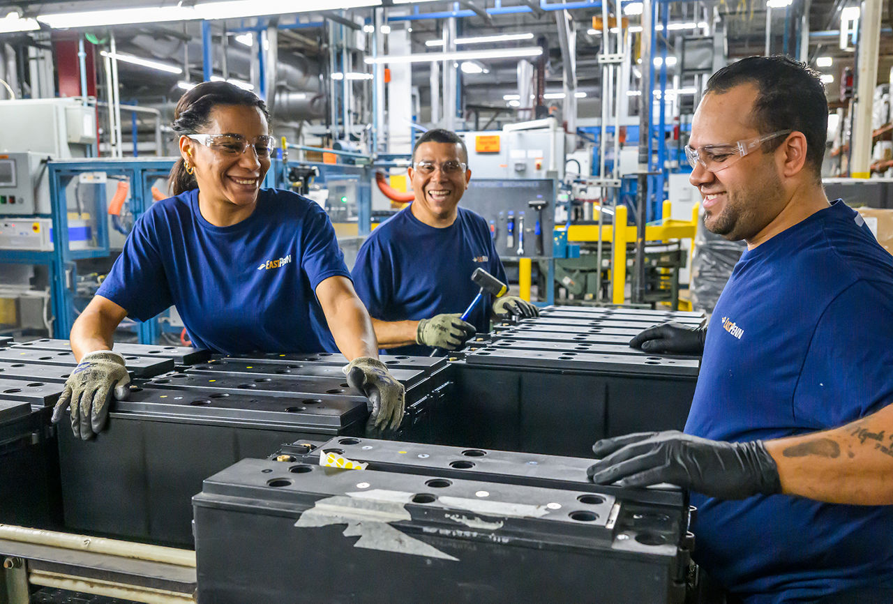 Workers on a hot manufacturing floor where indoor temperatures keep climbing